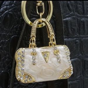 Lt Pink & crystal purse keychain.  NIP.  1.75 x 1.75 purse. Length 4.25”